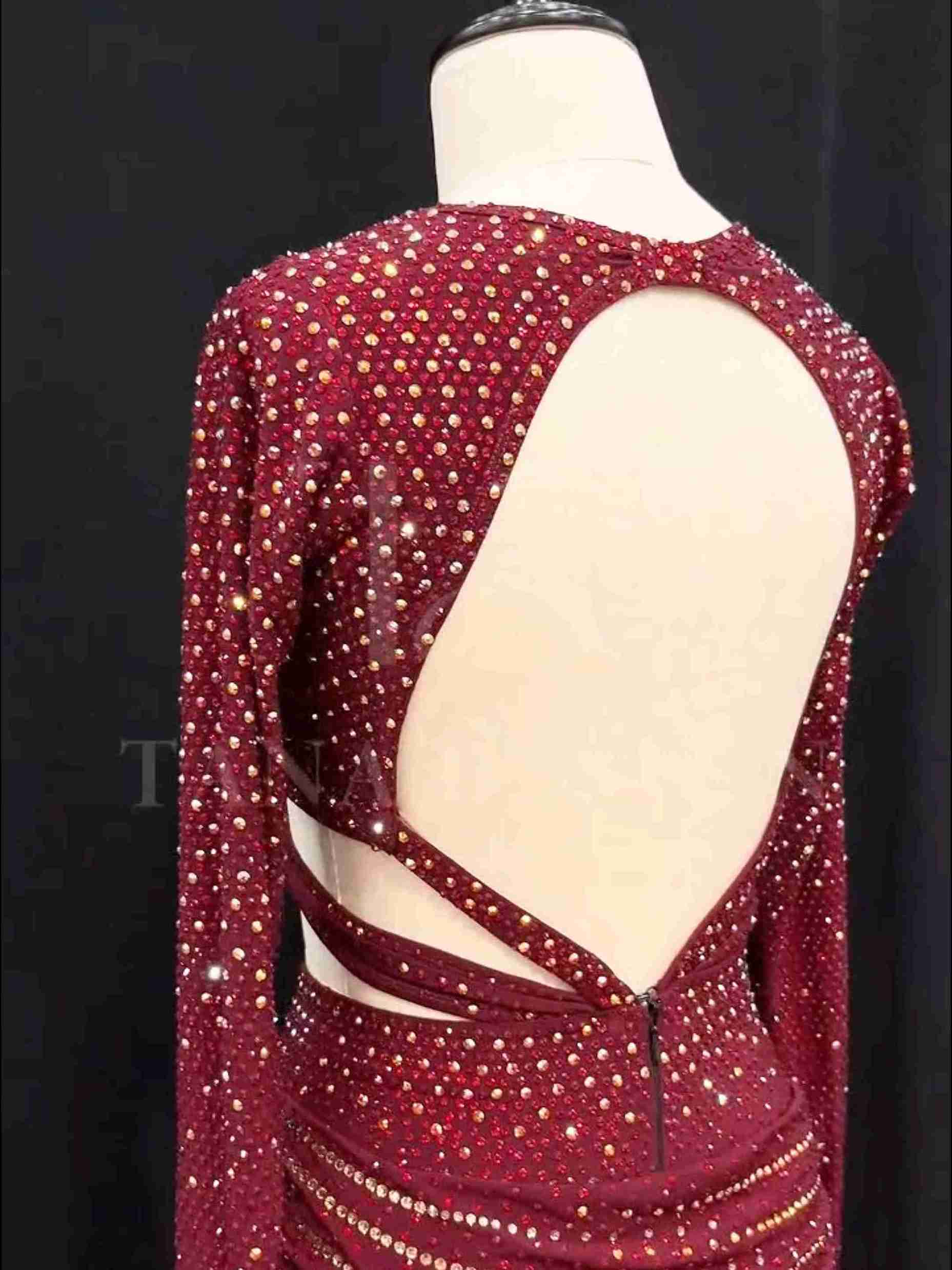 burgundy-two-piece-competition-dance-dress-tana-dancewear (2)_2_11zon Burgundy two-piece Latin dance costume with rhinestones, long sleeves, and fringe skirt details.