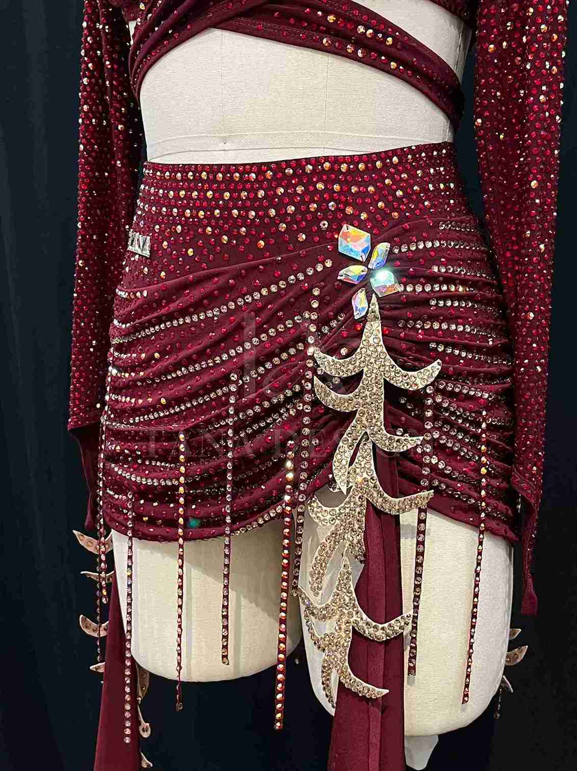 burgundy-two-piece-competition-dance-dress-tana-dancewear (4)_4_11zon Burgundy two-piece Latin dance costume with rhinestones, long sleeves, and fringe skirt details.