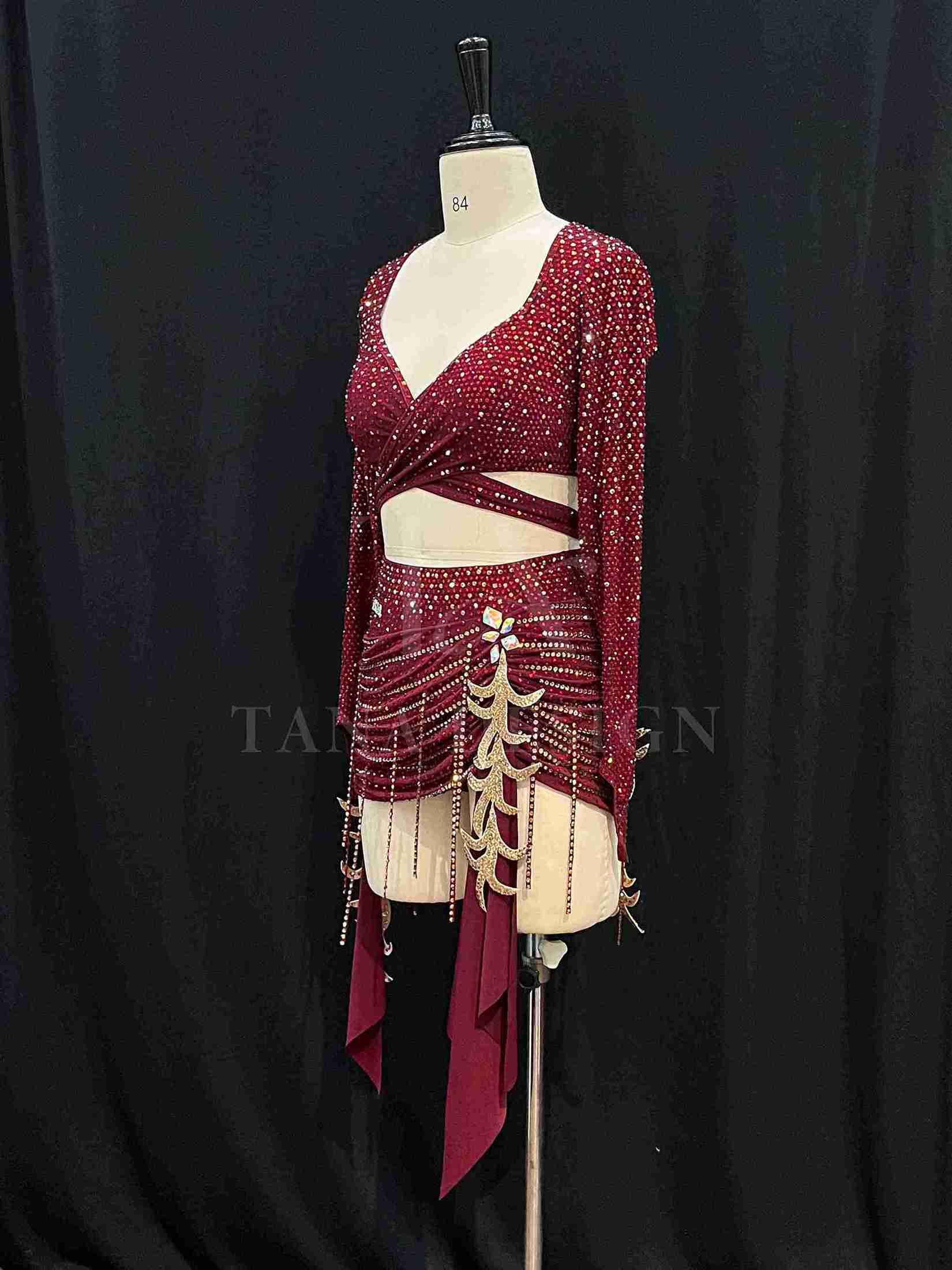 burgundy-two-piece-competition-dance-dress-tana-dancewear (7)_7_11zon Burgundy two-piece Latin dance costume with rhinestones, long sleeves, and fringe skirt details.