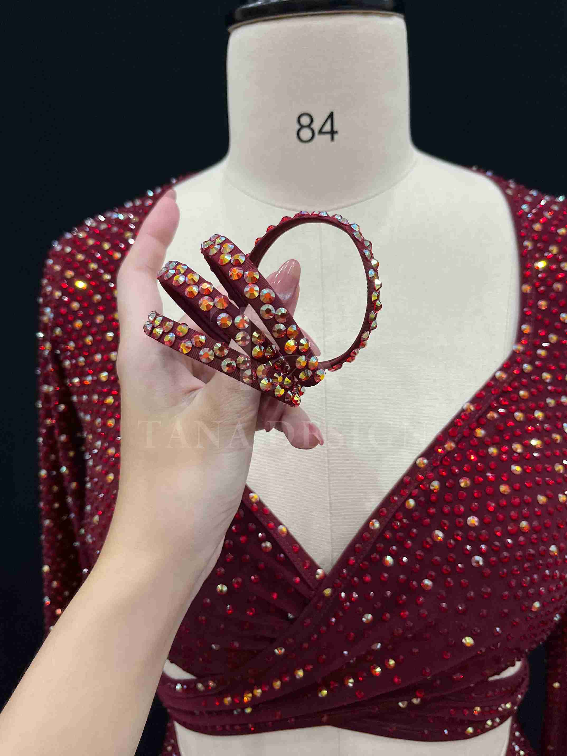 burgundy-two-piece-competition-dance-dress-tana-dancewear (9)_9_11zon Burgundy two-piece Latin dance costume with rhinestones, long sleeves, and fringe skirt details.
