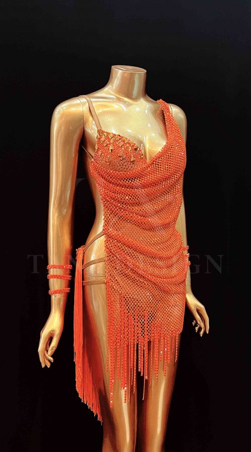 Sparkly orange open-back women competition Latin dance dress with lycra mesh, fringe and rhinestone details by Tana Dancewear.